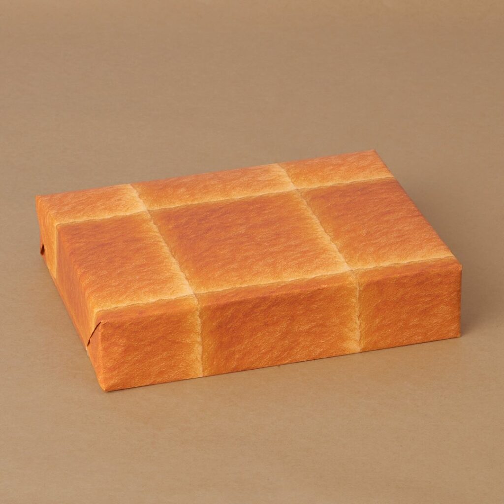 Japanese graphic designer Ippei Tsujio created wrapping paper that makes your gift look like bread